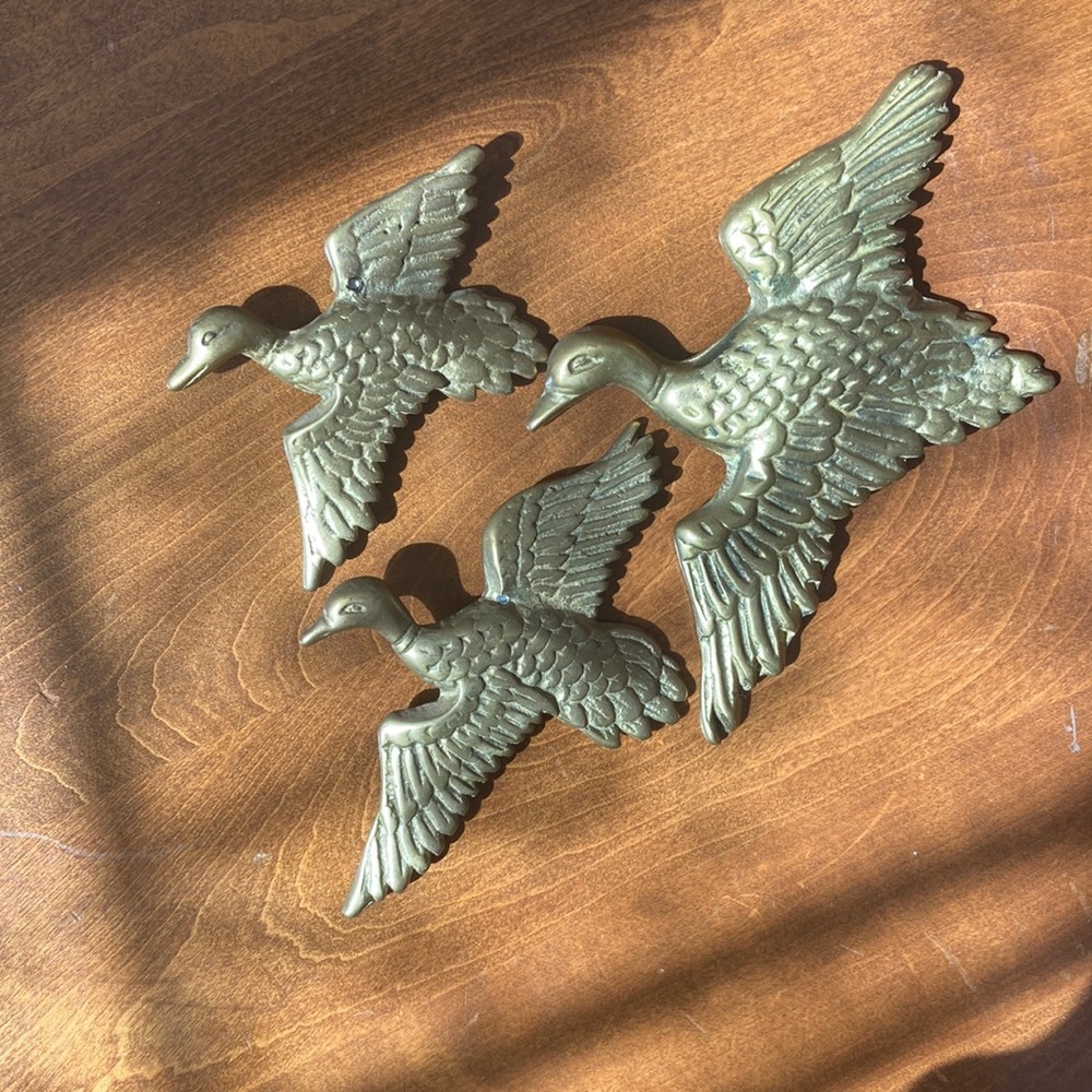 Brass ducks wall art